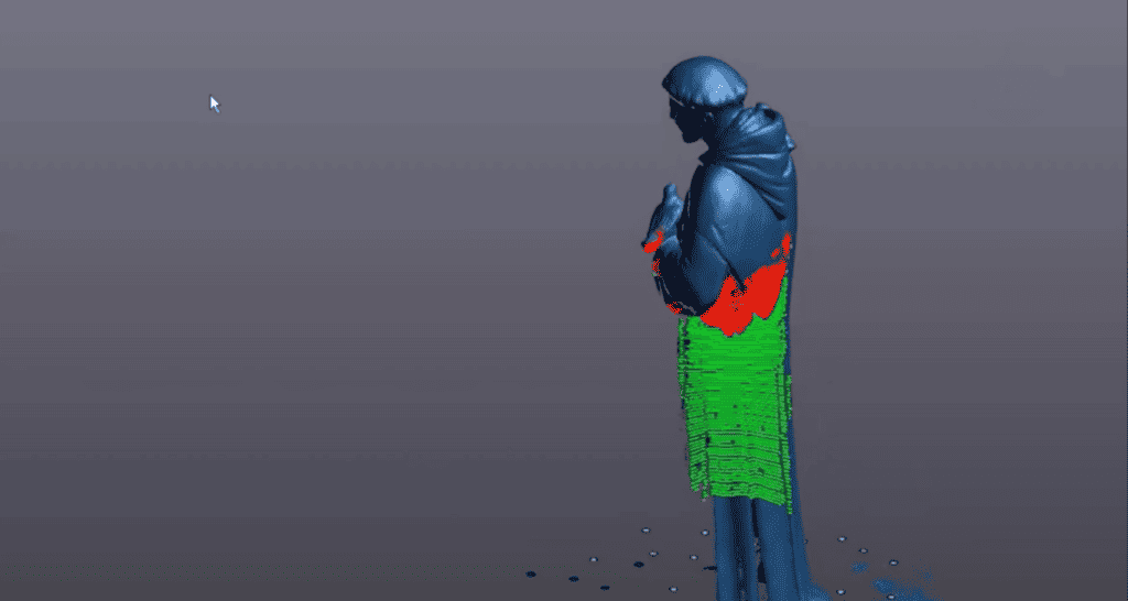 A 3D laser scanning computer graphic of a human figure with incomplete data represented by red and green dots.