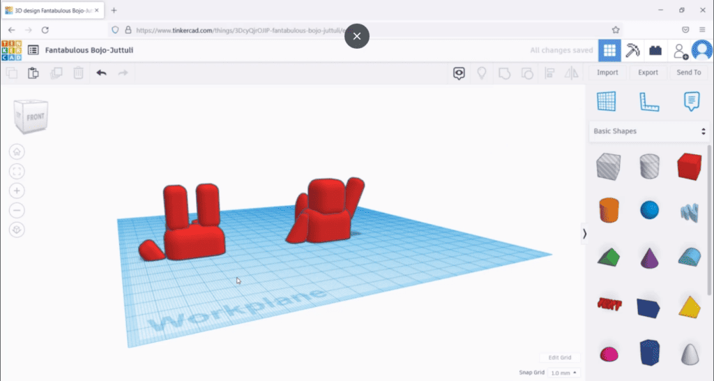 Two separate parts of a red figurine model displayed on the Tinkercad workplane, indicating a division for 3D printing.